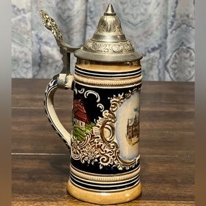 German beer stein with a pewter lid and hand-painted scene of Schweinfurt. 7”